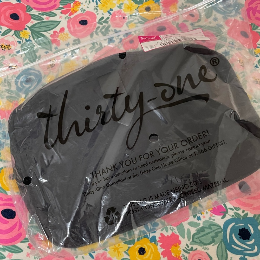 NEW in bag, out and about sling bag in black from thirty one
